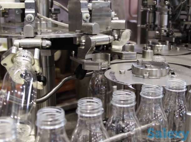 Линия розлива негазированной воды в ПЭТ тару объемом от 0,3 - 2,0 литра производительностью до 6000 бутылок в час, фотография 2